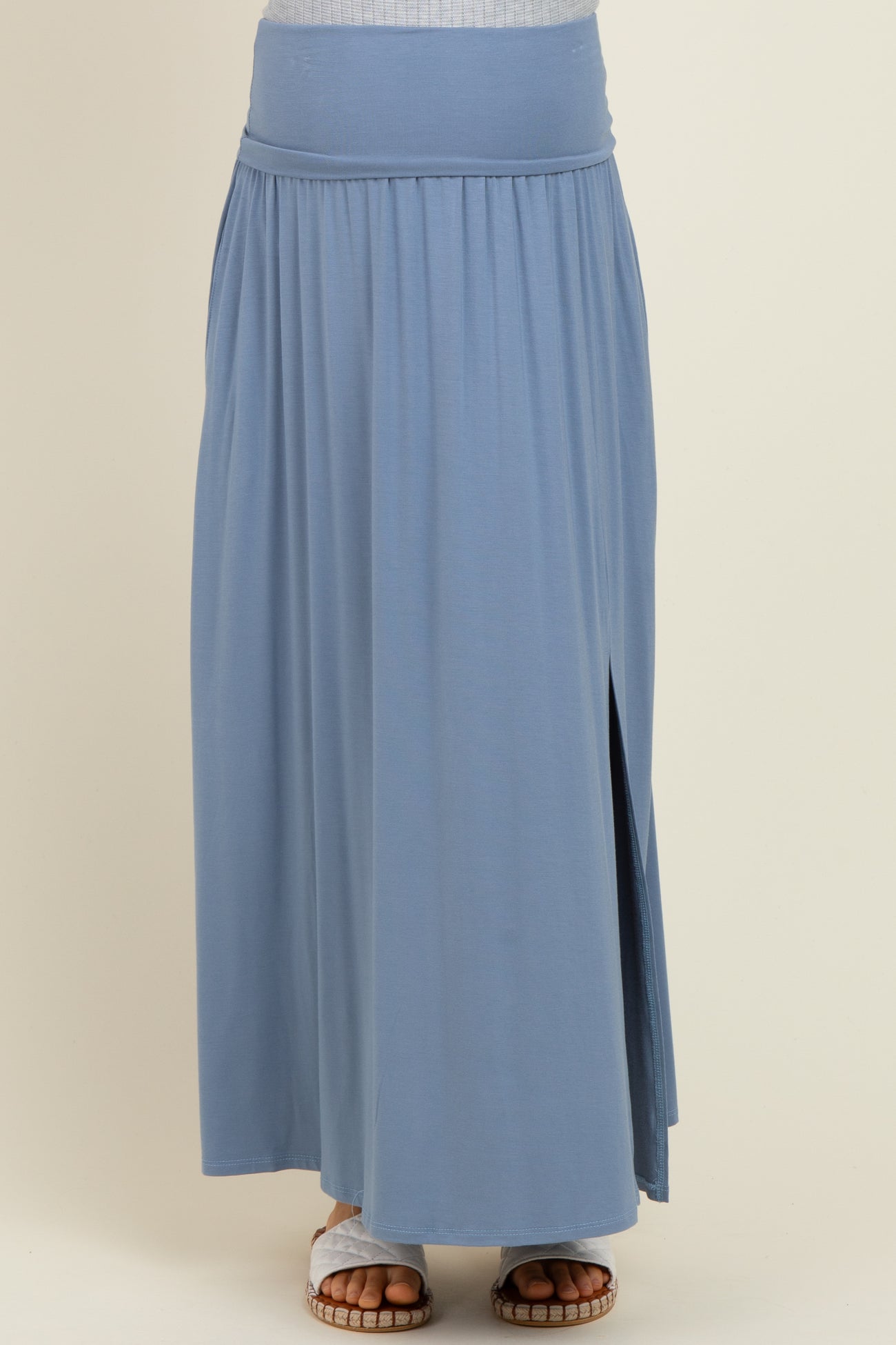 maternity wear blue maxi skirt with a high waist and side slit, model wearing flat sandals