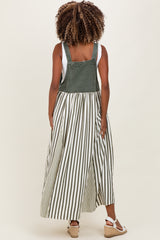 woman wearing a green and white striped maternity dress with a denim top and flowing skirt