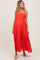 woman wearing a red maternity maxi dress with lace detailing, showcasing a baby bump