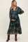 woman wearing a navy floral maternity maxi dress, holding her baby bump, with long sleeves and a tiered skirt