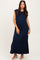 woman wearing a navy blue sleeveless maxi dress with side slits and a relaxed fit