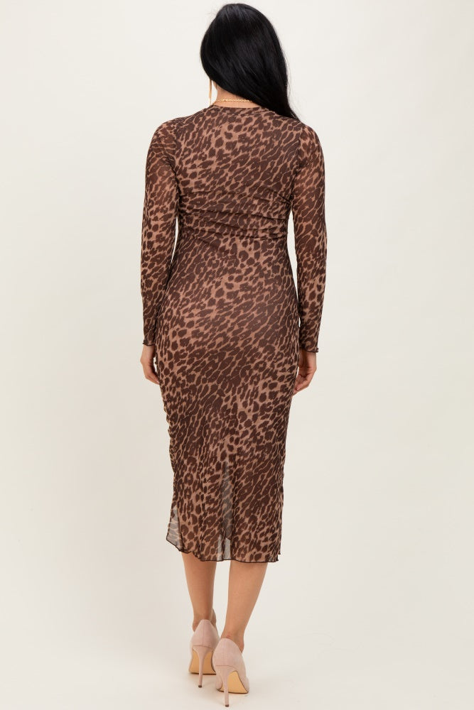 woman wearing a brown leopard print long sleeve midi dress from the back