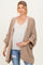 woman wearing a beige open-front cardigan over a white v-neck top and holding her baby bump, maternity wear