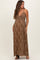 woman wearing a brown leopard print maxi maternity dress with a front zipper and adjustable straps, showing her baby bump