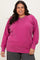 woman wearing a vibrant pink plus size v-neck sweatshirt with long sleeves and relaxed fit