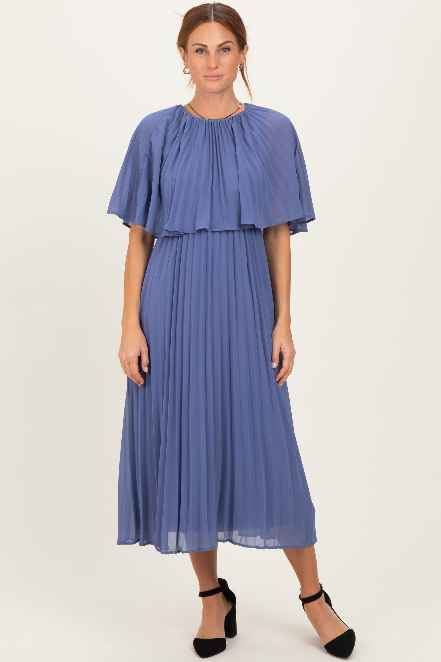 woman wearing a pleated midi dress in lavender with a flutter sleeve and a flowy silhouette