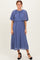 woman wearing a pleated midi dress in lavender with a flutter sleeve and a flowy silhouette