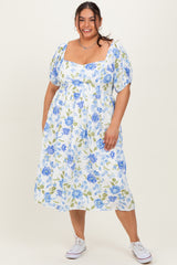 woman wearing a white floral plus-size midi dress with puff sleeves and a square neckline