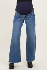 maternity wear blue wide leg jeans with a stretchy belly panel and frayed hem, worn by a model