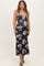 woman wearing a floral patterned navy blue maternity dress with a fitted silhouette and square neckline