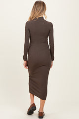 woman wearing a brown long sleeve maternity dress with a fitted silhouette and below-the-knee length from the back