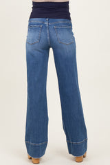 woman wearing blue maternity wide-leg jeans viewed from the back with a supportive waistband