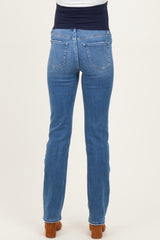 maternity wear light blue straight leg jeans with a navy blue over-the-bump waistband, shown from the back