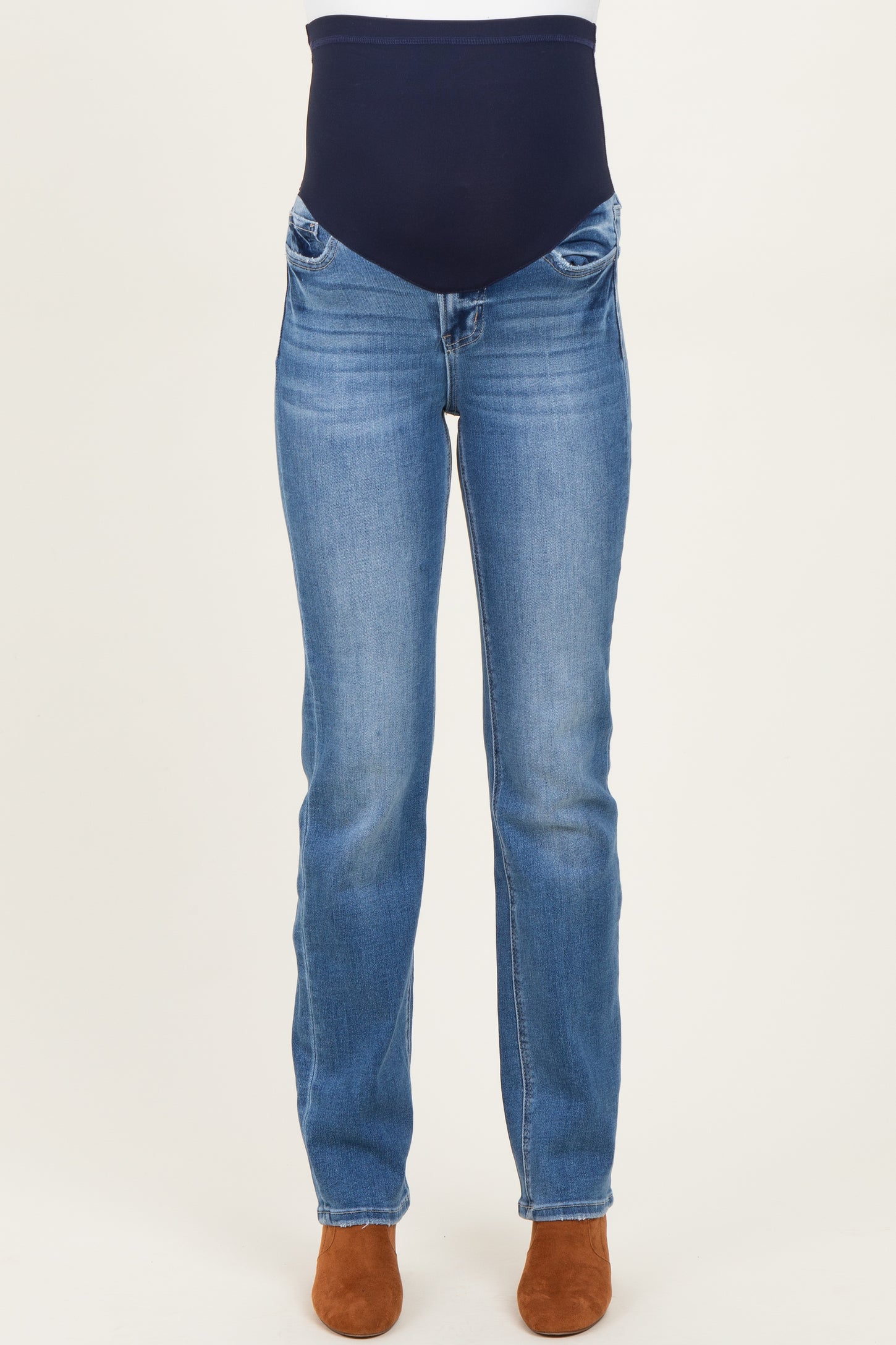 maternity wear blue straight leg jeans with a navy over-the-bump waistband, model wearing brown heeled booties