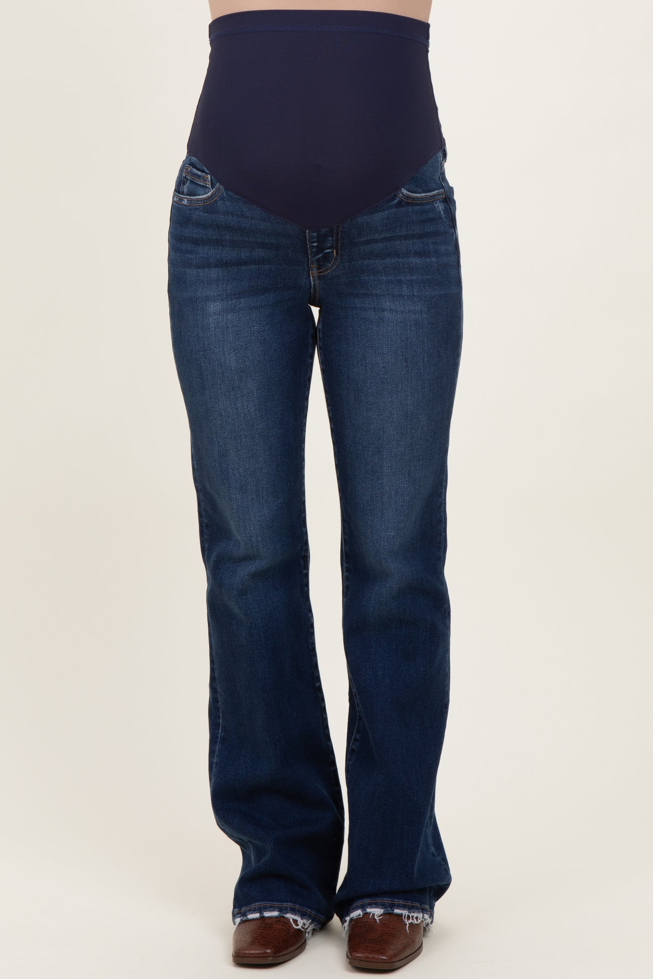 woman wearing dark blue maternity flare jeans with a high waistband