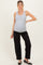 woman wearing a gray ribbed maternity tank top and black pants, showcasing her baby bump