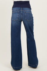 woman wearing dark blue maternity wide-leg jeans with a stretchy waistband, viewed from the back