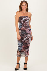 woman wearing a strapless fitted floral midi dress with ruching and a straight neckline