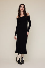 woman wearing a black off-the-shoulder ribbed maxi dress and black ankle boots