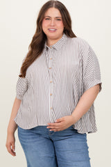 woman wearing a striped button-up maternity top with loose fit and short sleeves, showcasing her baby bump