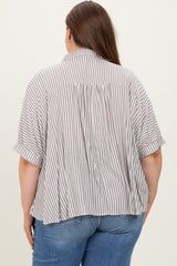 woman wearing a striped short sleeve maternity top, showing a loose fit and gathered back detail