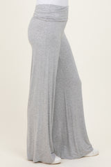 woman wearing light gray wide-leg pants with a fold-over waistband