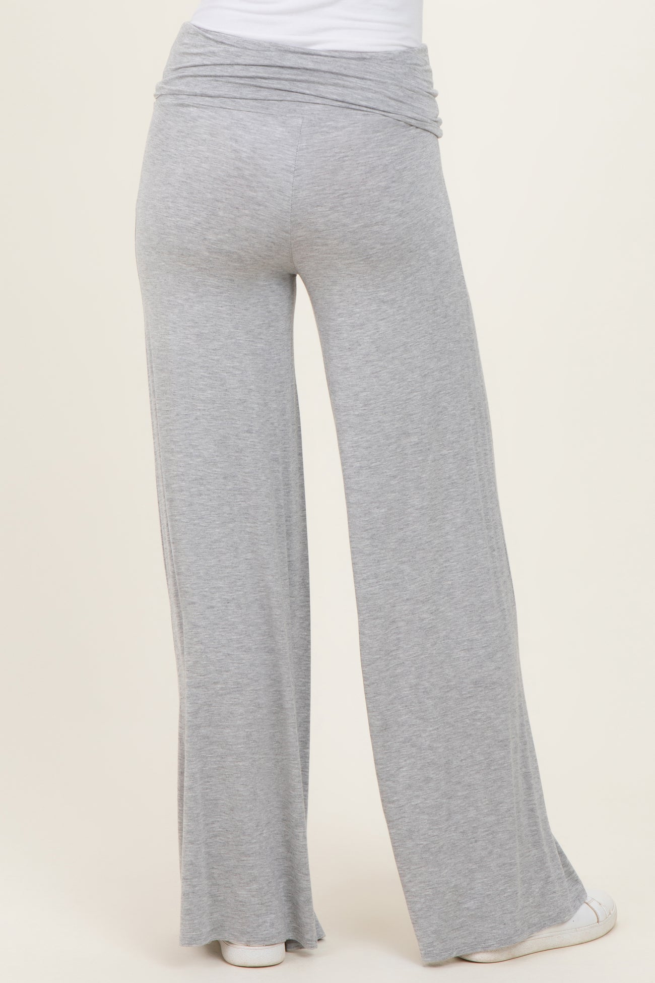 woman wearing gray wide-leg lounge pants with a ruched waistband