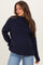 woman wearing a navy blue ribbed maternity sweater with a relaxed fit and visible baby bump