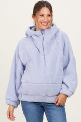 woman wearing a lavender maternity pullover hoodie with a cozy fleece texture and a front pocket