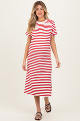 woman wearing a red and white striped maternity dress with short sleeves and a midi length, showcasing a baby bump