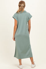 woman wearing a mint green maternity maxi dress with short sleeves, viewed from the back