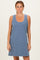woman wearing a navy and white striped sleeveless dress with a scoop neckline