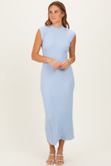 woman wearing a light blue ribbed midi dress with cap sleeves and a fitted silhouette