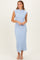 woman wearing a light blue ribbed midi dress with cap sleeves and a fitted silhouette