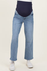 maternity wear blue straight leg jeans with a navy high waist panel, worn by a model standing on a neutral background