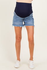 woman wearing dark blue maternity shorts with a high waistband and distressed denim detailing