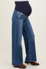 maternity wear blue wide-leg jeans with a supportive over-the-bump panel and a visible baby bump