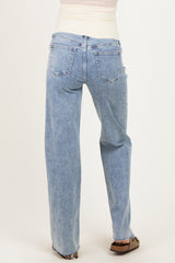 woman wearing light blue maternity jeans with a relaxed fit and back view showing subtle distressing at the hem