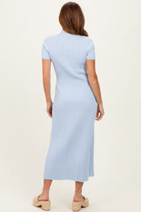 woman wearing a light blue ribbed midi dress with short sleeves and a fitted silhouette, viewed from the back