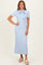 woman wearing a light blue ribbed midi dress with a bow tie detail and short sleeves