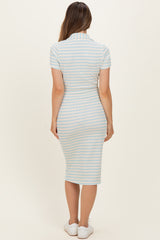 woman wearing a light blue and white striped maternity dress with a fitted silhouette and short sleeves