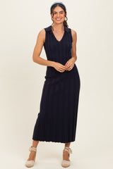 woman wearing a navy ribbed sleeveless maxi dress with a collar and a scouted hem
