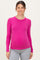 woman wearing a hot pink long sleeve maternity top and showing her baby bump