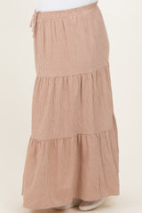 maternity wear in a brown checkered tiered maxi skirt with an adjustable drawstring waistband