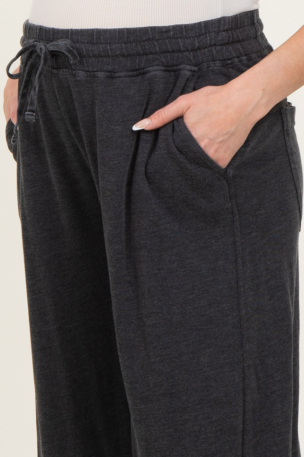 maternity wear dark grey jogger pants with pockets and an elastic waistband, styled for comfort