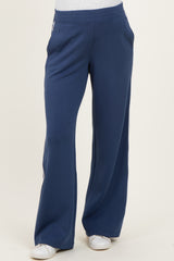 woman wearing navy blue maternity sweatpants with a relaxed fit and side pockets
