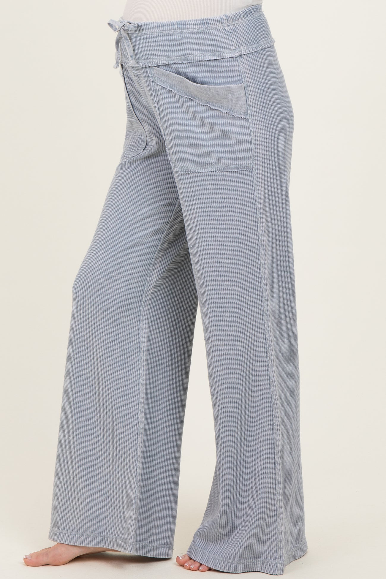 light blue maternity wide-leg pants with a drawstring waist and side pockets