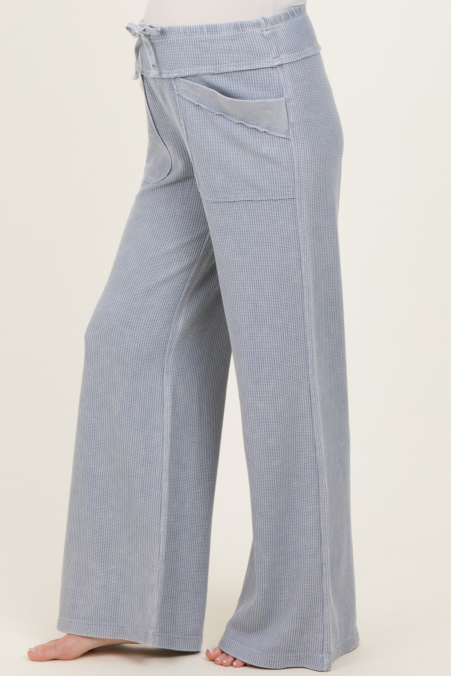 light blue maternity wide-leg pants with a drawstring waist and side pockets