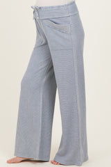 light blue maternity wide-leg pants with a drawstring waist and side pockets