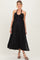 woman wearing a black halter neck maternity maxi dress with a flowing silhouette and visible baby bump